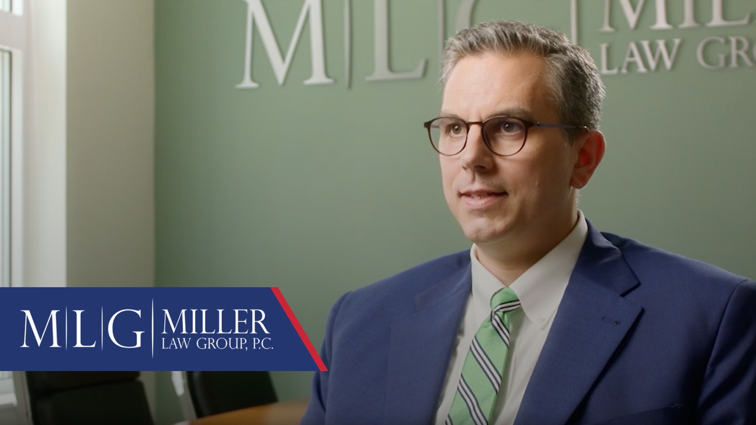 Group of attorneys seated around a conference table